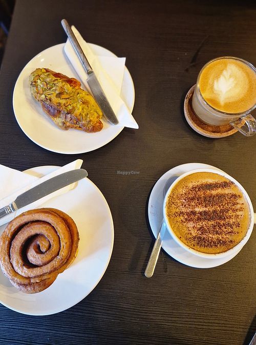Cinnamon roll, pistachio croissant,  oat flat white and oat cap at The Willows Tea & Coffee House in Todmorden