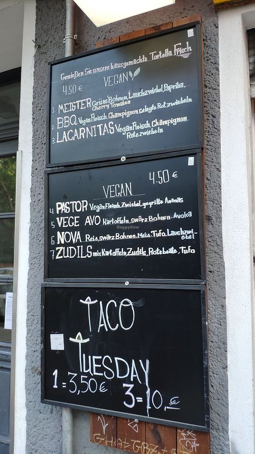 Menu at the front of building at Taco Meister in Berlin