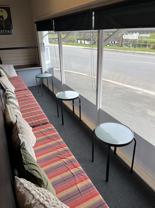 Cute enclosed verandah. Sit and watch the turbot chooks in the park across the road.  at Dixie Blue in Deloraine