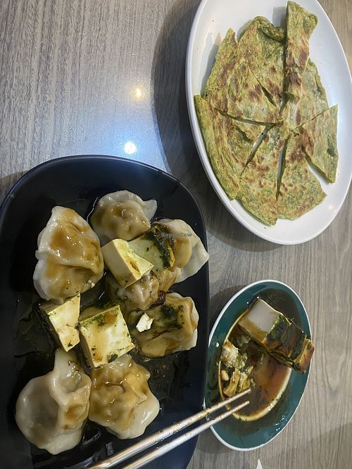 Dumplings, toon tofu, and toon pancakes (there was more on the plates before the photo was taken)  at Yang Shin Yuan Vegetarian - 養心園素食 in Chiayi