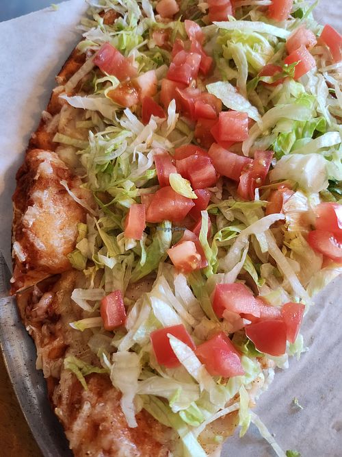 Pizza with vegan cheese at Mendi's Pizza Ltd in Independence