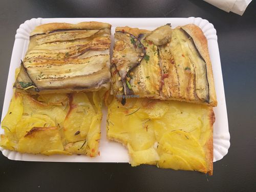 Slice of spicy aubergine pizza and slice of potato with rosemary pizza at Alice Pizza Tivoli in Tivoli