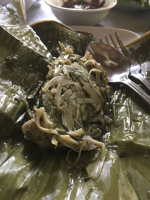 Needle mushroom cooked inside a banana leaf  at Tamarind - A Taste of Laos in Luang Prabang