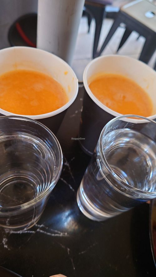 Freshly pressed orange juices and free water at Early Bites in Athens