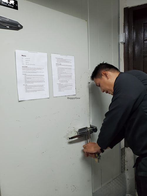 Head Chef Marlon entering the restaurant's freezers. Note that for the kitchen, both freezers and refrigeration have backup generators. at Atlantis Restaurant in Puerto Galera