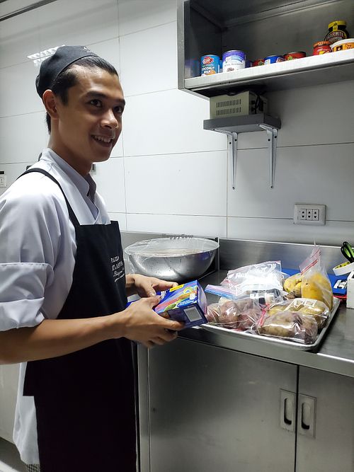 Preparing my "to go" kit of airline commute food at Atlantis Restaurant in Puerto Galera