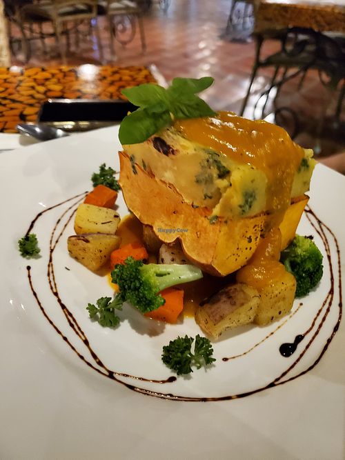Stuffed Orange Squash topped with herbed mashed potatoes. at Atlantis Restaurant in Puerto Galera