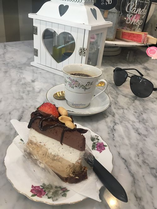 Peanut chocolate cake and Americano coffee at Simply Raw Bakery and Bistro in Vienna