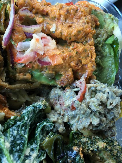 Avocado plantain pie entree w sides (wild rice, kale, broccoli, etc) at Khepra's Raw Food Juice Bar in Washington