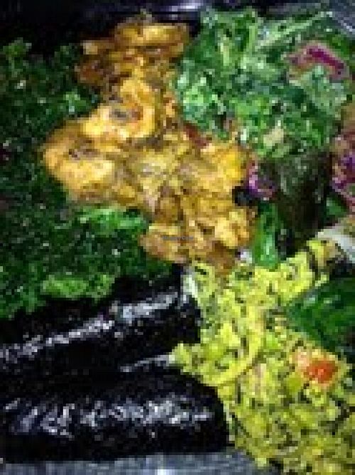 Nori rolls, garlic kale, fried plantains, wild rice, and spinach sea salad at Khepra's Raw Food Juice Bar in Washington