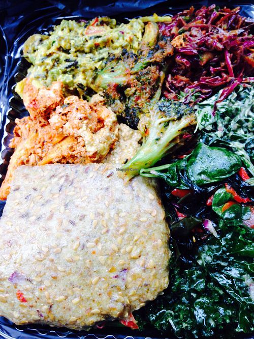 Burger with sides at Khepra's Raw Food Juice Bar in Washington