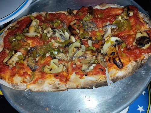Dragon Fired Pizza, no cheese with all the veggies. A little pricey because it's a small portion ($18) but very happy to have the option! at Lou's Blues Bar & Grill in Indialantic