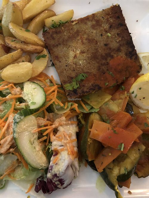 Seitan escalope, roast potatoes, ratatouille, raw veggies with mustard   at Le Grenier de Notre Dame in Paris