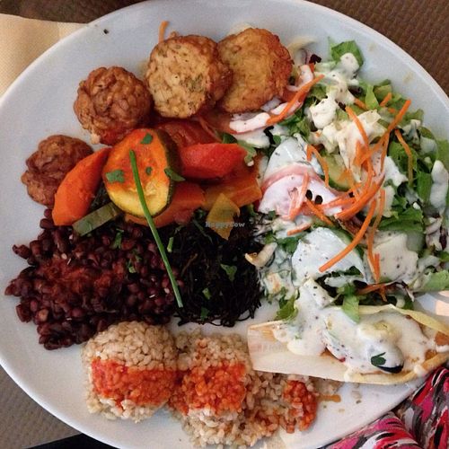 I ordered the first vegan plat on the menu and it was fantastic! It was brown rice and adzuki beans with tomato sauce, ratatouille vegetables, seitan, fresh crisp salad with creamy vegan dressing, endive with a pumpkin purée, and wakame seaweed.  at Le Grenier de Notre Dame in Paris