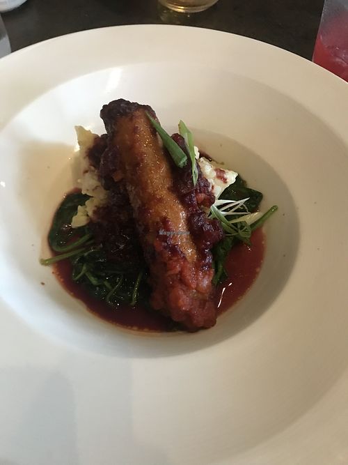 Italian Sausage (only available at dinner) with Beyond sausage, risotto, roasted tomato sauce, and spinach   at By Word of Mouth in Big Sky