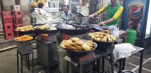 Making food at Madhur Milan Cafe in Varanasi