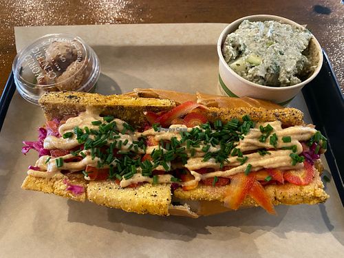 Spicy tofu sandwich with sides of not-chicken nuggets (upper left) and cucumber-dill potato salad (upper right) at Sia's in Pittsburgh