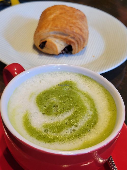 Matcha latte and a chocolate croissant at 123V Bakery in London