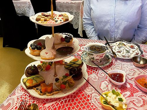 Three-tiered cake stand with sweet and savory vegan bites  at Queen of Hearts in Henderson