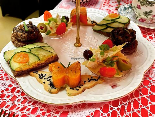 Savory vegan bites including sweet potato butterflies, mushrooms topped with Queen Anne’s lace, cucumber and roasted red pepper hummus sandwiches, and farfalle pasta with olives. at Queen of Hearts in Henderson