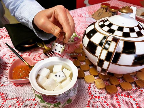 Sugar cubes resembling dice next to teapot .  at Queen of Hearts in Henderson