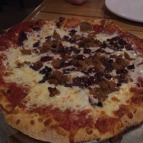 vegan Italian sausage & kalamata olive pizza at The Mitten Brewing Co in Grand Rapids