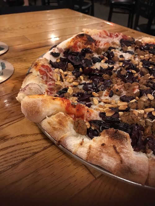 Vegan cheese, vegan sausage, pine nuts and black olive pizza : ) at The Mitten Brewing Co in Grand Rapids