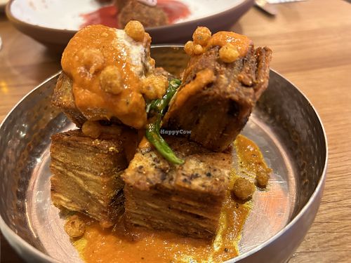 makhani mille feuille: crunchy layered potato cubes, cashew makhani sauce  at Mallow - Canary Wharf in East London