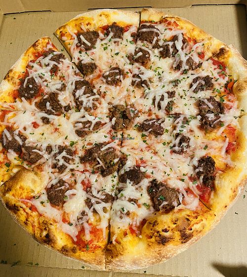 Dairy-free cheese pizza with vegan meatballs   at Angry Italian in Yuma