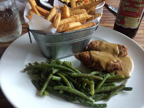 Country fried tofu, Cajun fries, and green beans. at Southern Charm Kitchen in Gainesville
