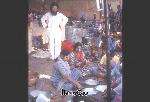 Overseeing the hundreds of volunteer food prep people that helped serve 1600 Westerners, Bombay, India. at Vegetarian Underground Restaurant in Cypress