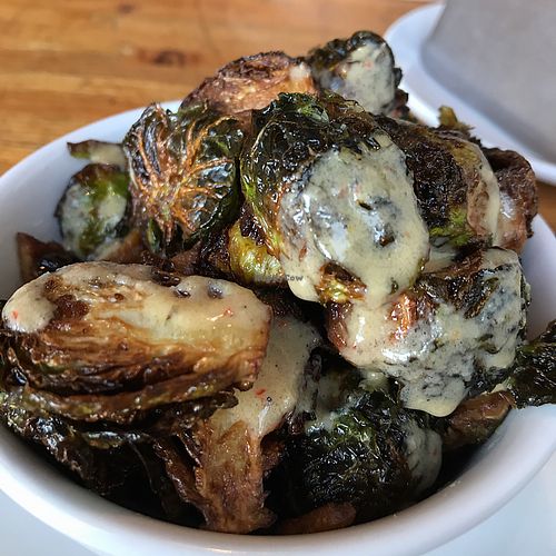 Brussels Sprouts with tempeh bacon & tahini dressing  at Green New American Vegetarian in Tempe