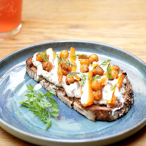 toast with aubergine babaganoush, grilled carrots, tahini and roasted chickpeas  at botànic in Barcelona