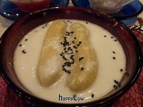 Banana dessert with hot coconut milk at Na Aroon in Bangkok