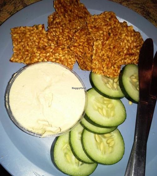 100% Raw/Vegan Shakti homemade creamy cashew cheese served with dehydrated gluten-free crackers, and cucumber slices. at European Street in Jacksonville