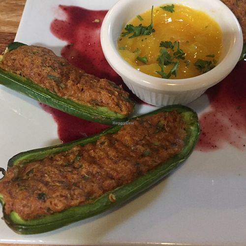 Jalepeno popers with a cashew quinoa stuffing and mango fruit sauce.  at Zest Kitchen & Bar in Salt Lake City