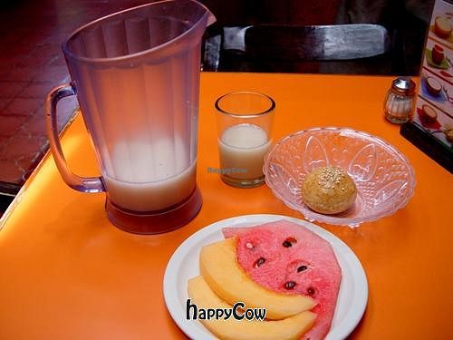 first course, chilled drink, whole grain roll, fruit salad at Orien's Vegetariano in Morelia