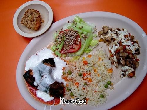 main course, stuffed chili, braised mushrooms, rice, garden salad, then a small sweet roll for dessert at Orien's Vegetariano in Morelia