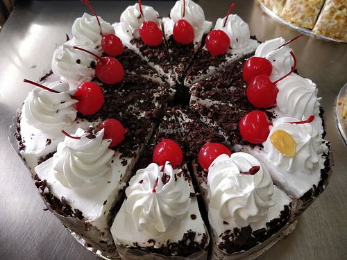 Chocolate cake with cream and cherry topping at Eastern Highland Healthy Cake House 东山 in East Singapore