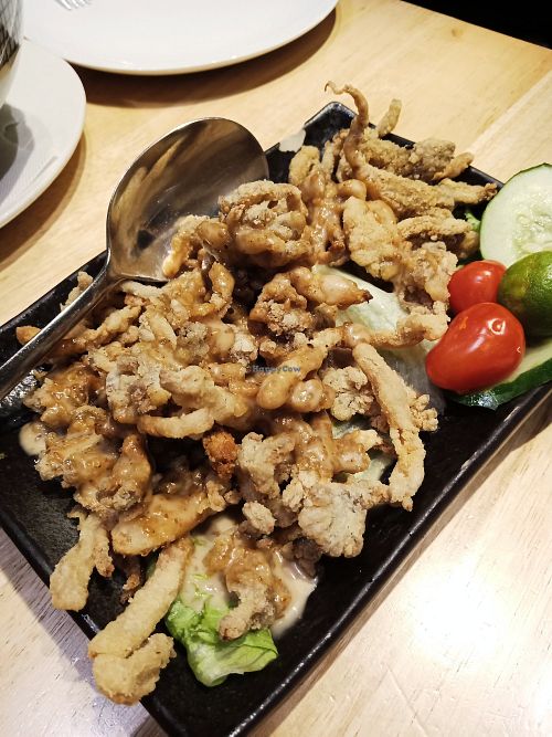 Crispy oyster mushrooms with sesame dressing. Vegan, with no eggs or dairy in batter. at Beyond Veggie by Secret Recipe in Petaling Jaya