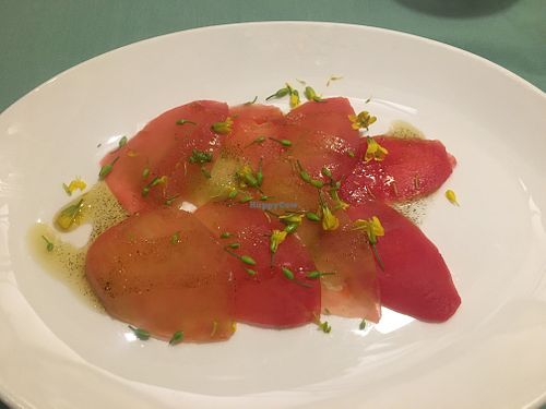 tomato carpaccio, lime zest and vanilla dressing at L'Elephant Vert in Luang Prabang
