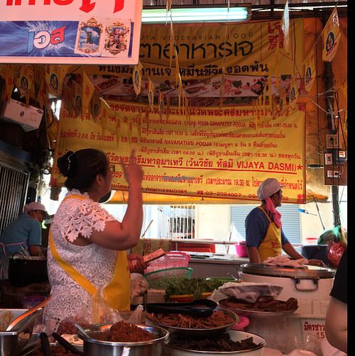 look for the big yellow sign at Vegan Thai Food Stalls in Bangkok