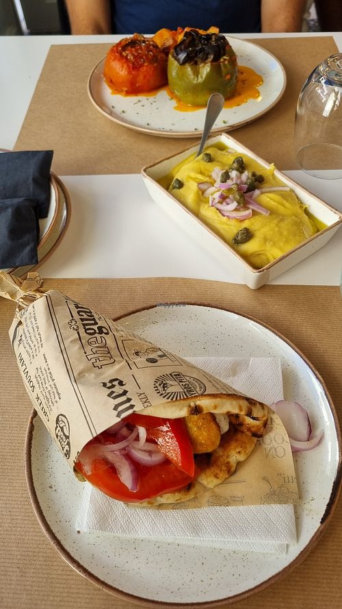 Falafel Gyros (ask to remove Tzaziki to make it vegan). Vegan + gluten free option: fava beans 'hummus', rice stuffed tomatoes and peppers. at PARAVAS in Naxos