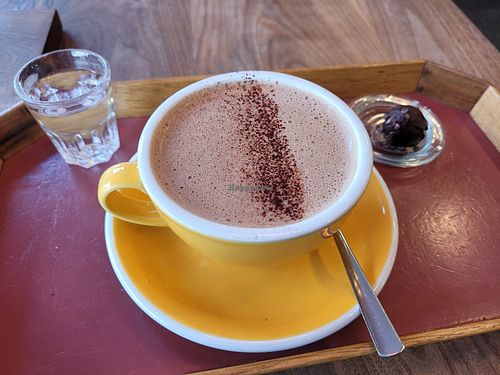 Hot chocolate with soy milk and a free piece of chocolate! at Laurent Gerbaud Chocolatier in Brussels