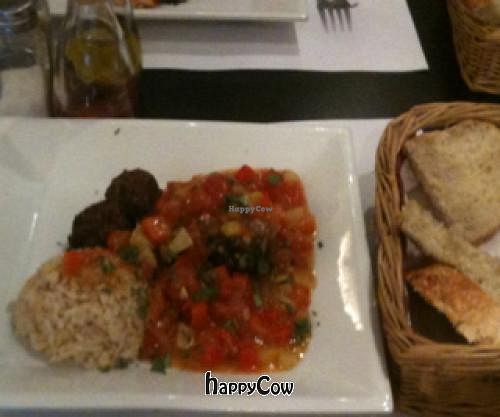 main course: Quinoa/Spinach balls with delicious puerto Rican sauce with tomatoes and pineapple. Home made bread also pictured, so good! at Lady Green Bio-Vegetarian Restaurant in Sitges