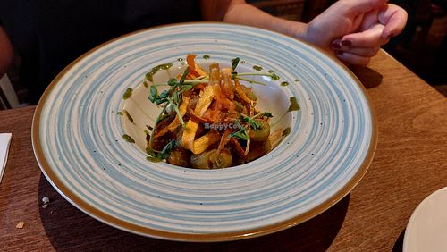 Spinach gnocchi with tomato sauce and fried veggies at Klauzál Café in Budapest