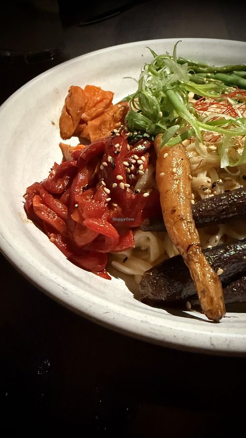 Chef’s creation with glazed carrots, wild-foraged Squamish mushrooms, yams, beans, peppers, noodles and peanut   at The Raven Room in Whistler