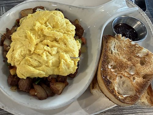 Skillet with beyond sausage and Just eggs, dry sourdough toast. No vegan cheese available any more    at The Breakfast Company in Sarasota