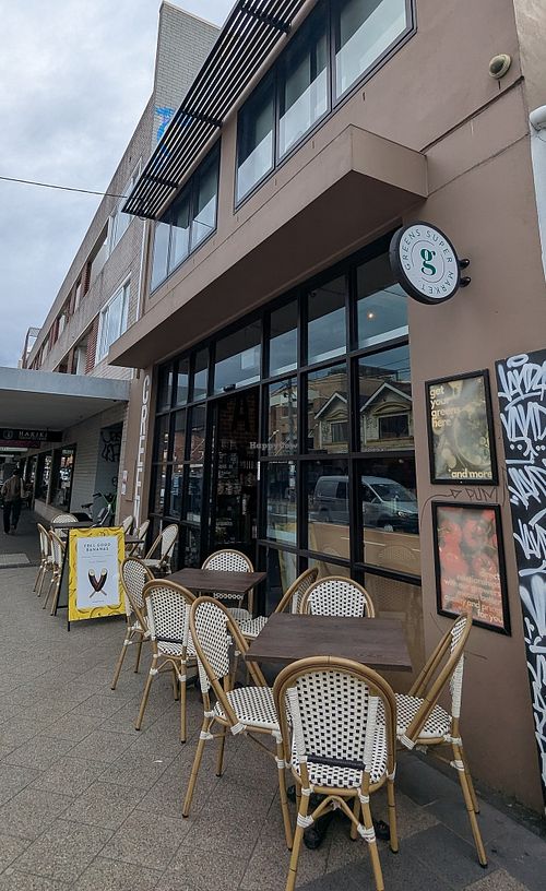 Outdoor seating at Greens Supermarket in Newtown