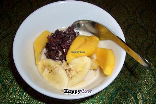 Dessert: black sticky rice in coconut milk with mango and banana at May Kaidee's Vegetarian Restaurant - Samsen in Bangkok